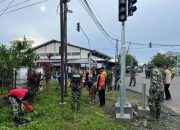 Tingkatkan Sinergitas, Anggota Koramil 1308-14/Toili Ikuti Kamis Kerja Bakti Bersama di Rusa Kencana